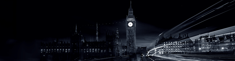 Big Ben at night with car light trails