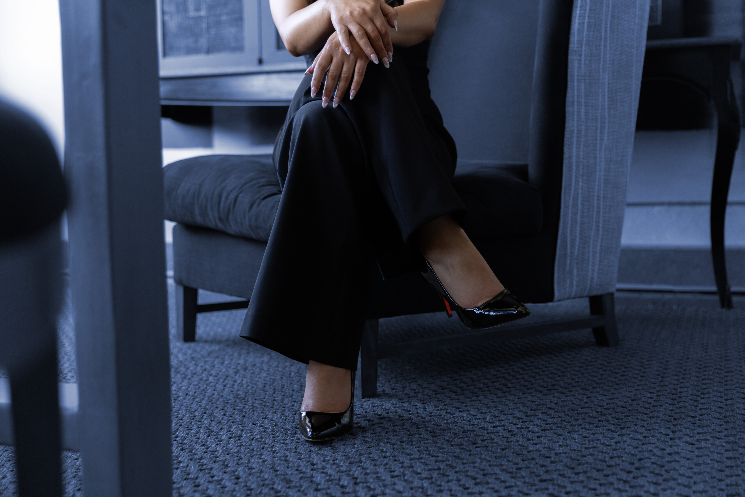 Roladex folded legs hands crossed chair_